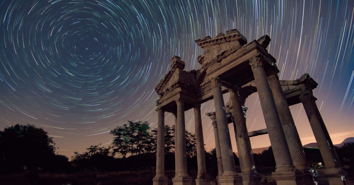 Long exposure of star trails over Aphrodisias ruins at night.