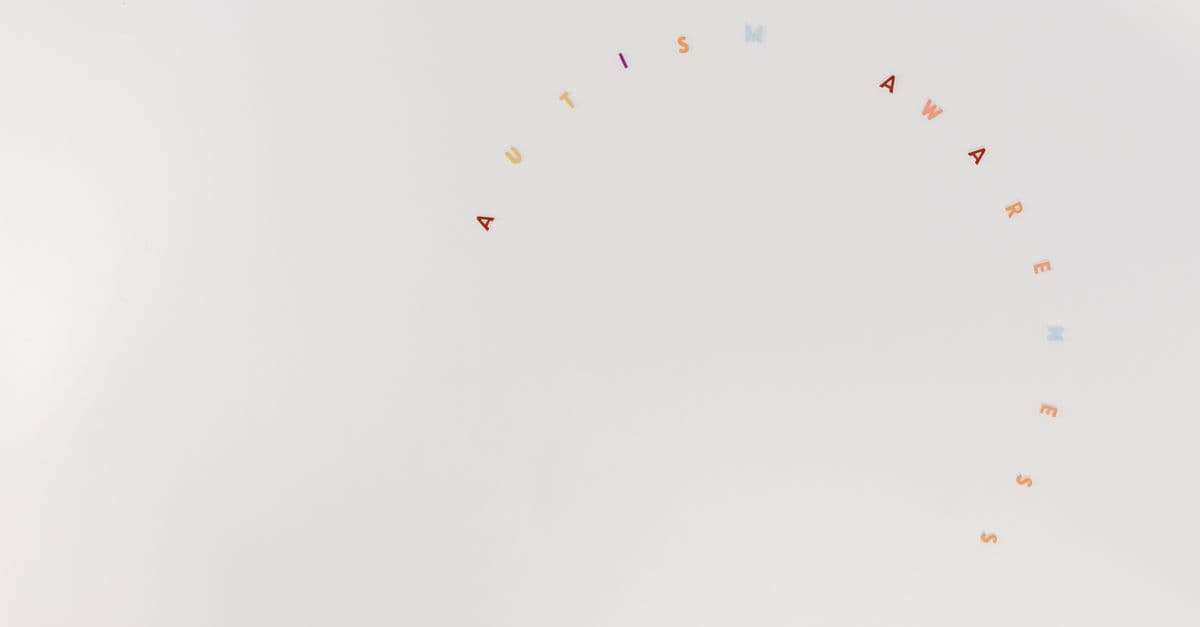 Minimalist design featuring autism awareness lettering on a clean white background.