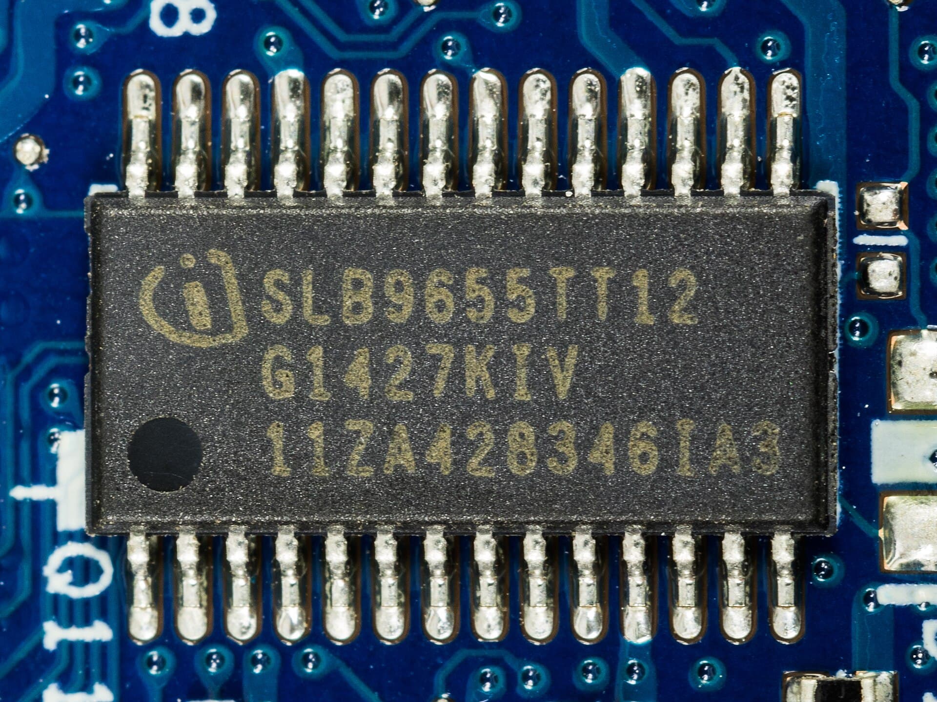 A close-up of a computer motherboard and trusted-platform chip representing hardware-based confidential computing.