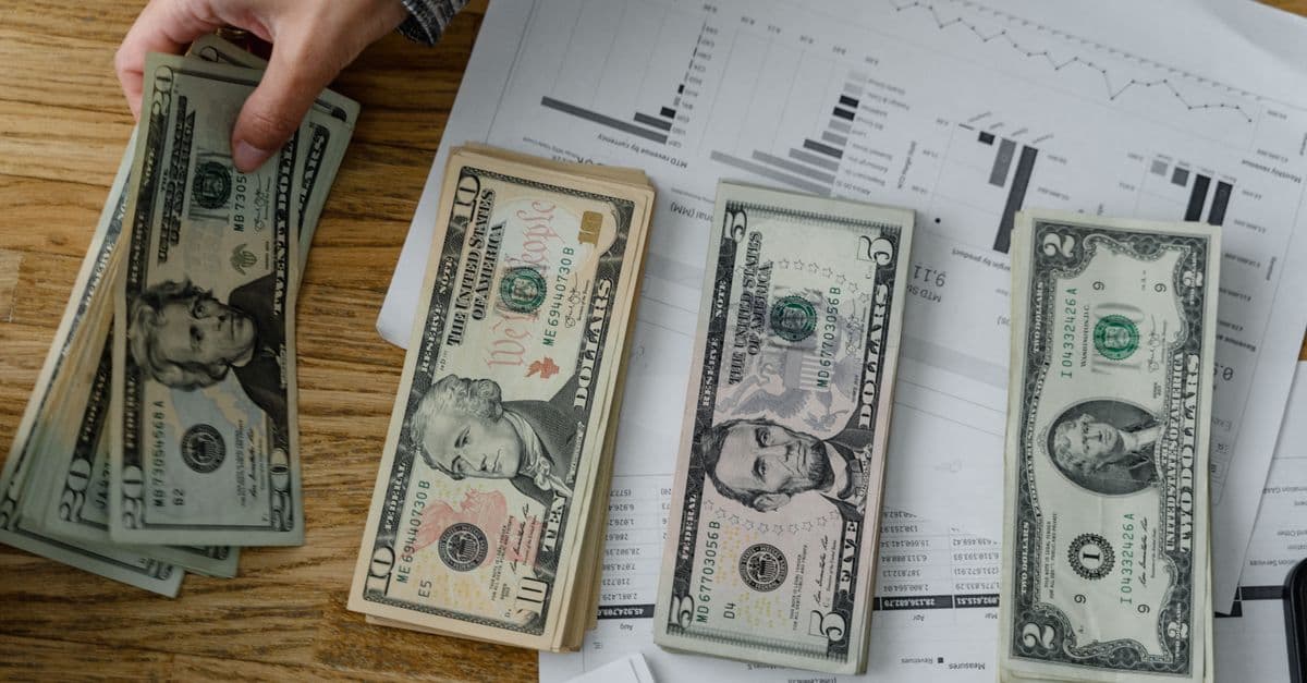 A rising line chart, calculator and currency notes representing inflation and consumer prices.