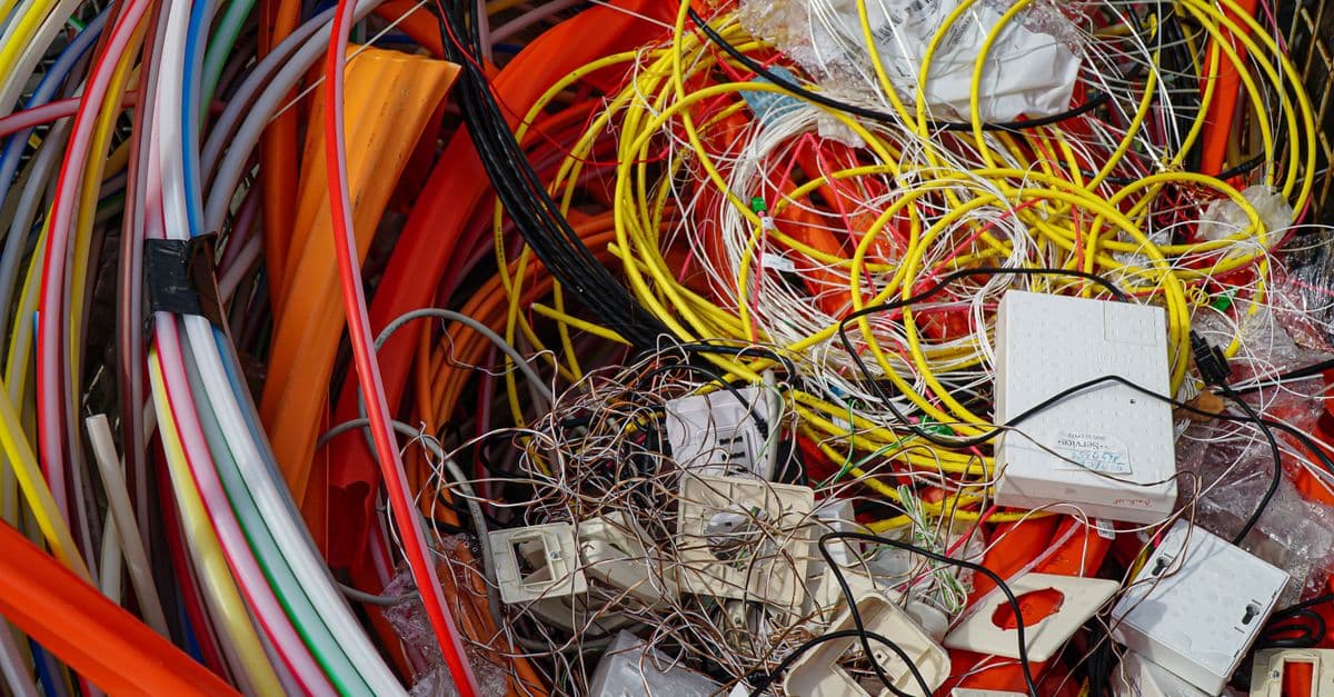 A vibrant mixture of electrical cables and waste ready for recycling.
