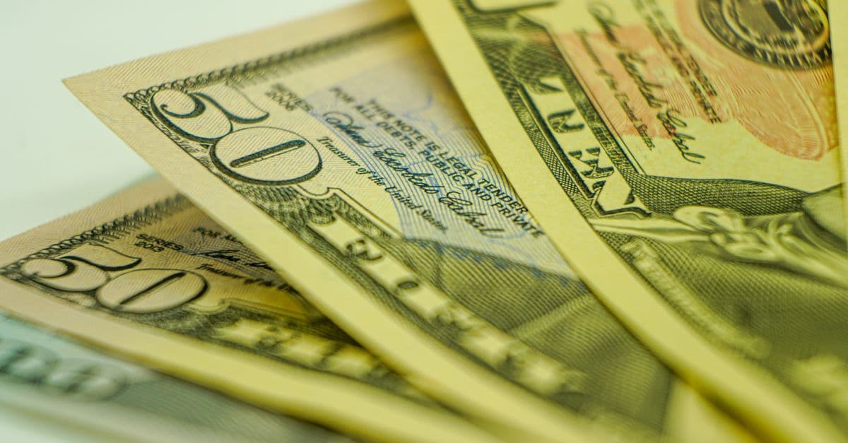Macro shot of American dollar bills displaying currency detail for finance-related concepts.