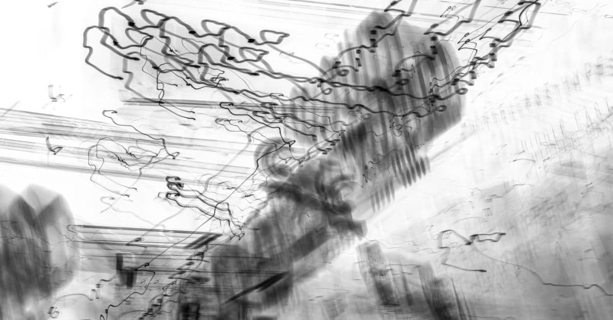 Intriguing black and white abstract composition with dynamic lines and patterns.