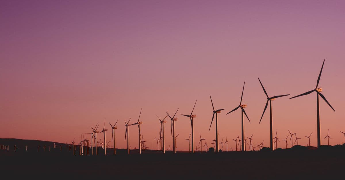 Silhouetted wind turbines at sunset in Zahara de los Atunes, Spain.