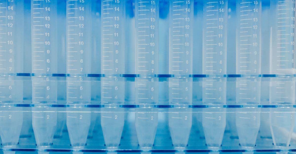 Array of clear lab test tubes with measurement markings, ready for scientific research.