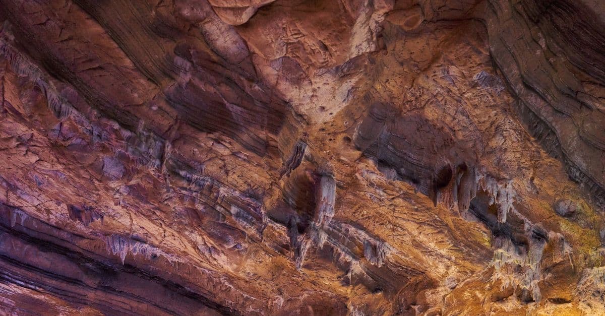 Close-up of a naturally eroded cave ceiling showcasing unique rock formations.