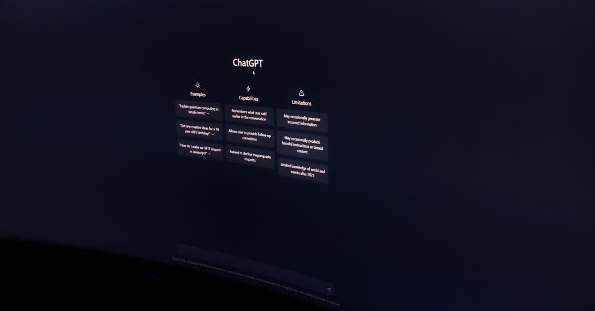 A dark, minimalist photo of a computer monitor displaying the ChatGPT interface.