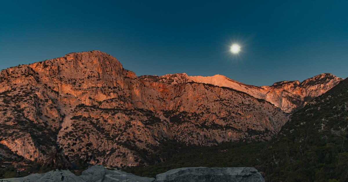 Breathtaking mountain view under the moonlight, showcasing natural beauty.