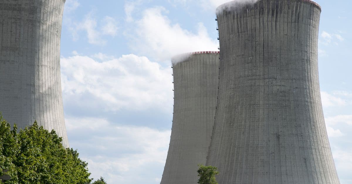 Cooling towers of Dukovany nuclear power plant with steam on a clear day.