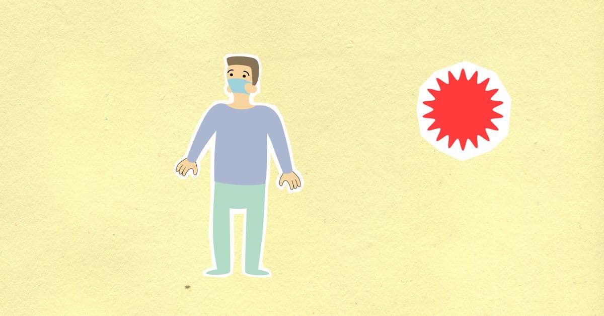 Cutout cardboard appliques of human figure in protective mask and red virus during COVID 19 pandemic on yellow background