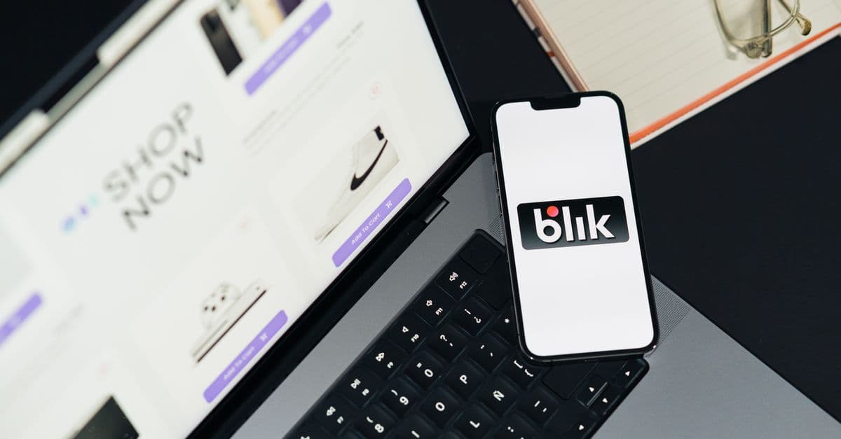A laptop and smartphone displaying online shopping platforms, hinting at e-commerce trends.