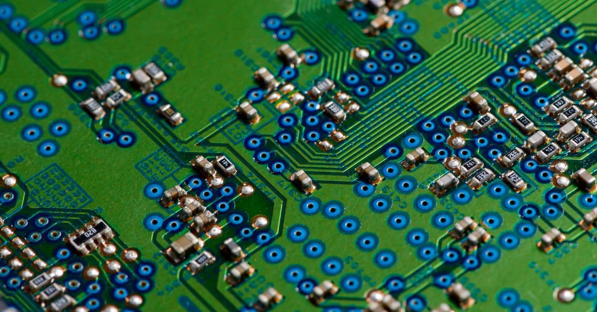 Detailed image of green circuit board showcasing electronic components for technology use.