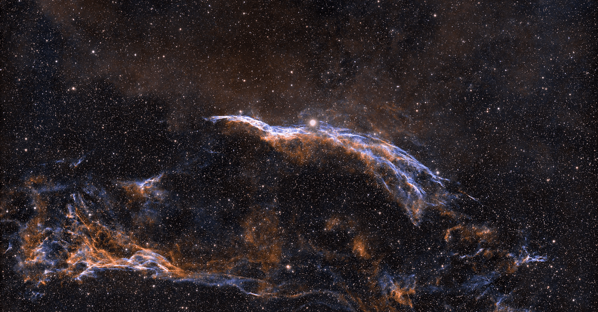 Spectacular image of the Veil Nebula showcasing intricate cosmic details and vibrant colors.