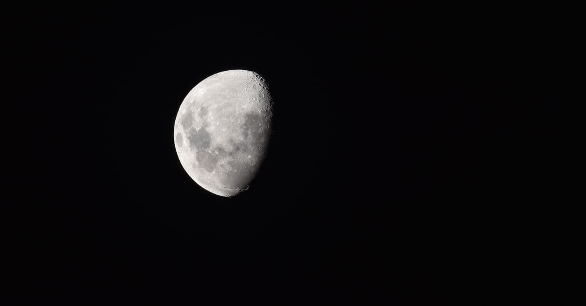 A mesmerizing view of a waning gibbous moon against the clear night sky.