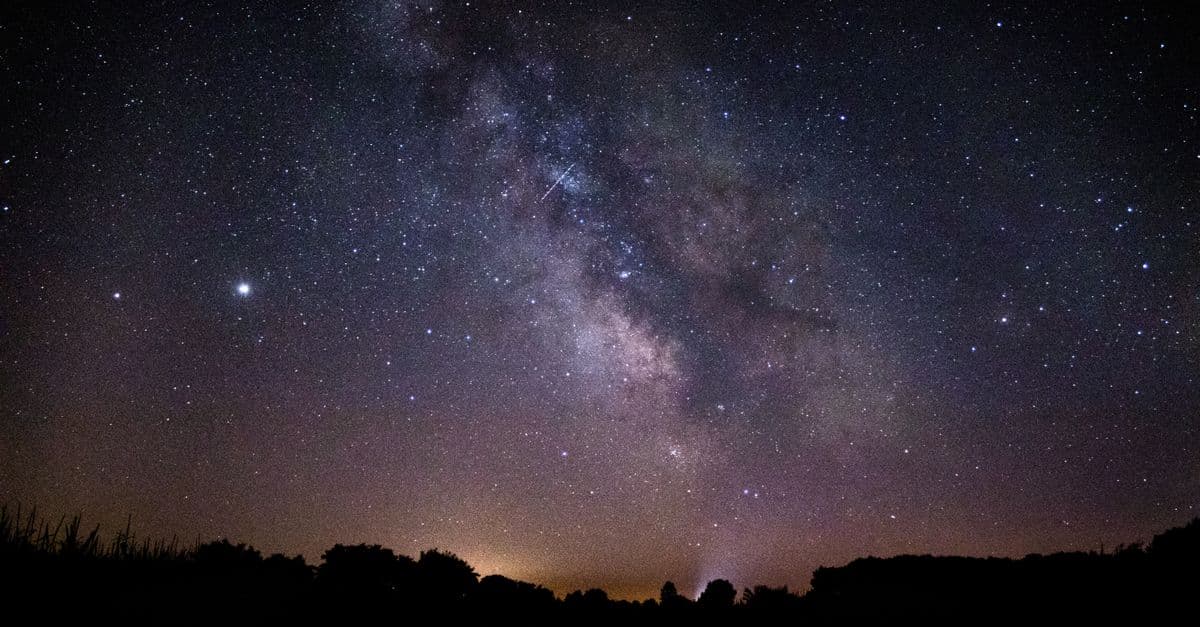 A breathtaking view of the Milky Way galaxy illuminating the night sky, showcasing countless stars and celestial beauty.