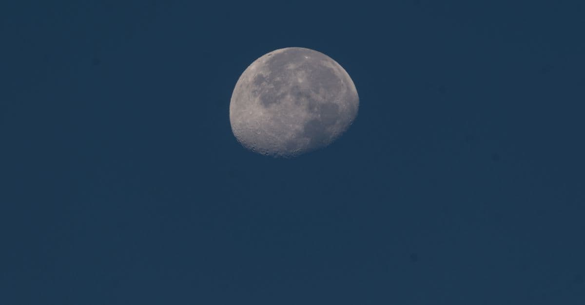 A crescent moon shining brightly against a clear night sky in İzmir, Turkey.