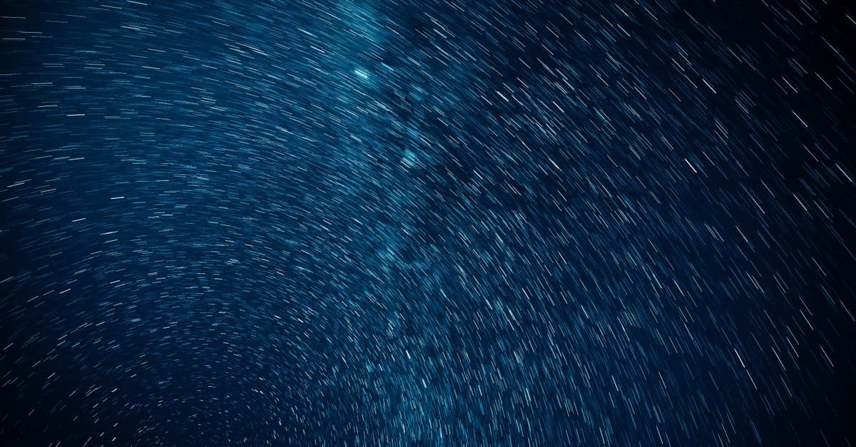 Long exposure photo capturing mesmerizing star trails in the night sky.