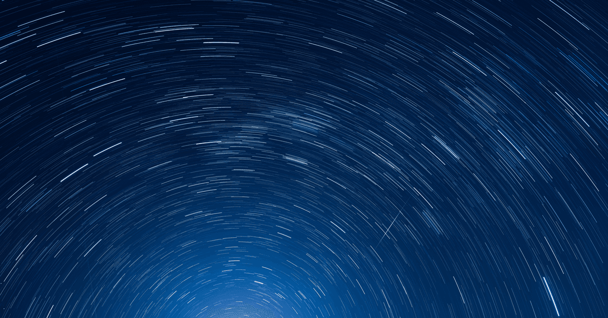Long exposure capture of mesmerizing star trails creating circular patterns in Sydney, Australia night sky.