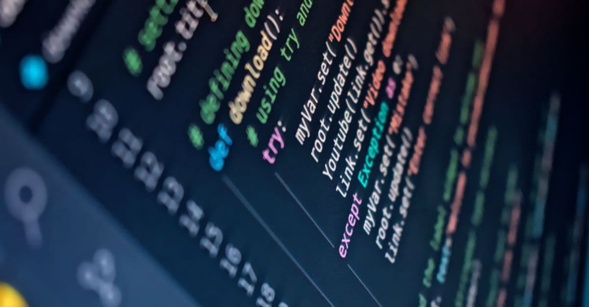Close-up of a computer screen displaying colorful programming code with depth of field.