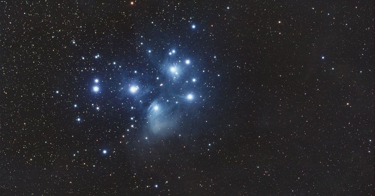 Captivating image of the Pleiades star cluster illuminating the night sky with a stunning cosmic display.