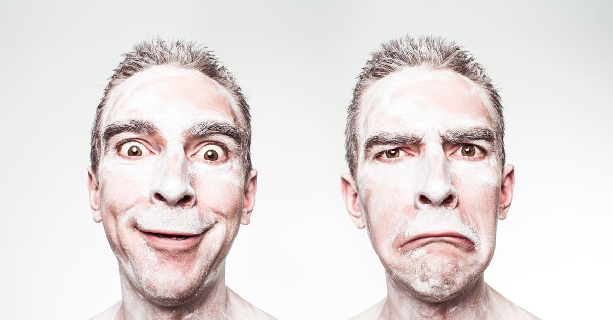 A whimsical portrait showing dual expressions of a man with a painted face.