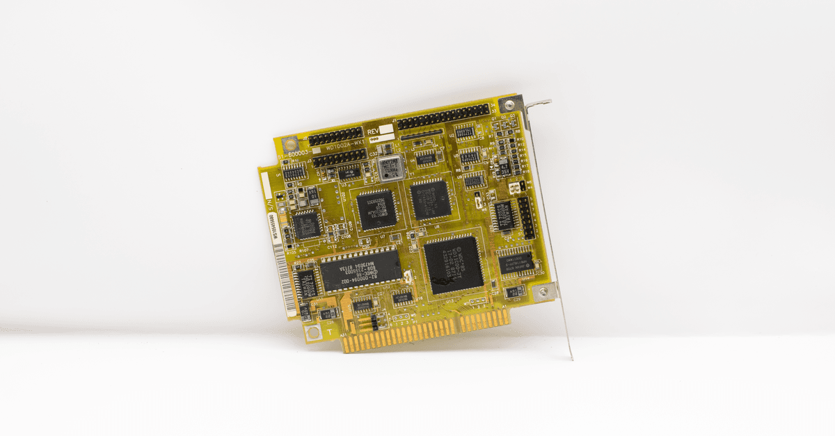 Antique circuit board showcasing vintage computing technology, isolated on a white background.
