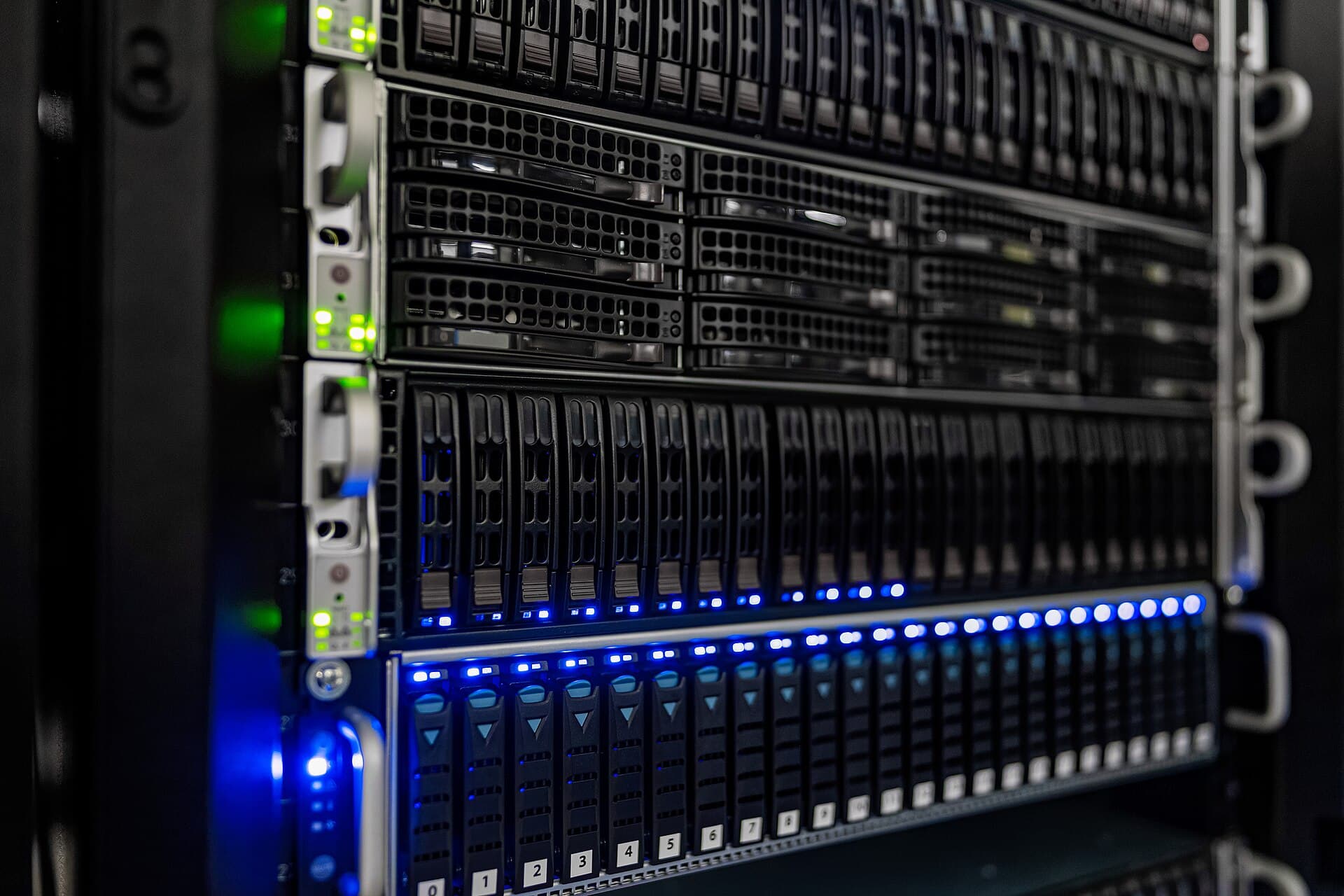 Rows of server racks in a data center representing the compute infrastructure used by model-routing systems.