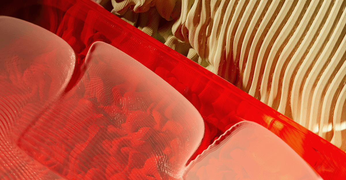 Artistic abstract with bright red and beige patterns and textures.