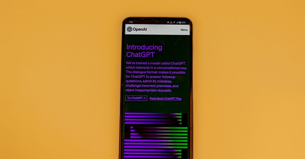 Smartphone displaying ChatGPT interface on a vibrant background, showcasing AI technology.