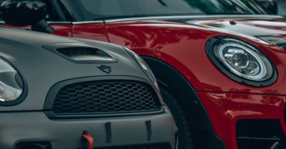 A detailed close-up view of Mini Cooper front grille and headlights.