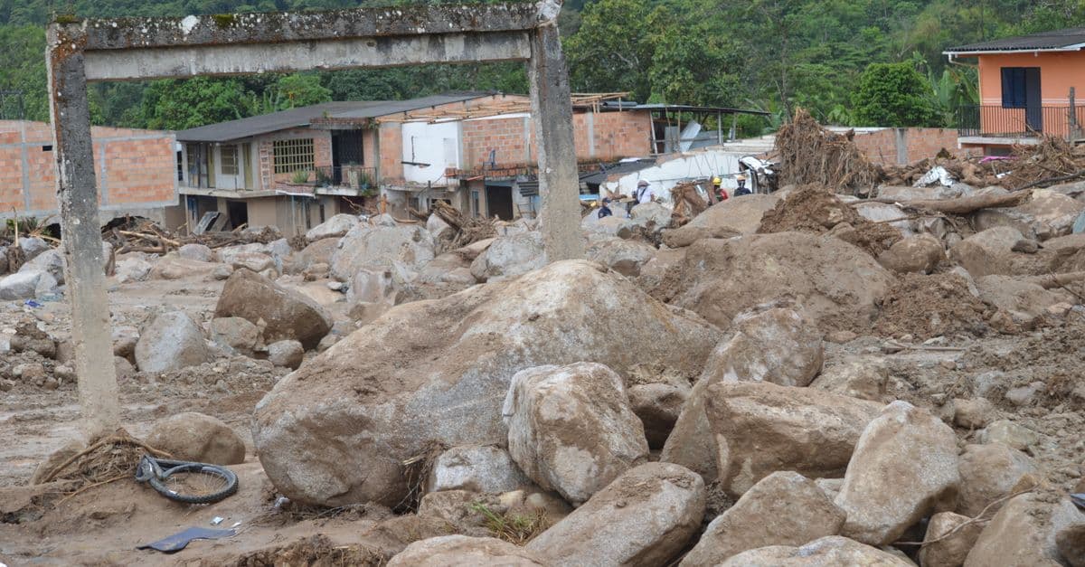 Destruction in Mocoa, Colombia, following a massive landslide, showcasing devastated buildings and debris.