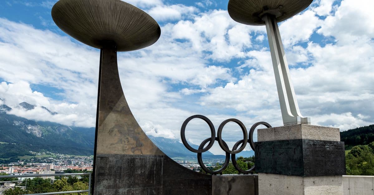 Olympic monument in Innsbruck with scenic alpine background, perfect for travel images.