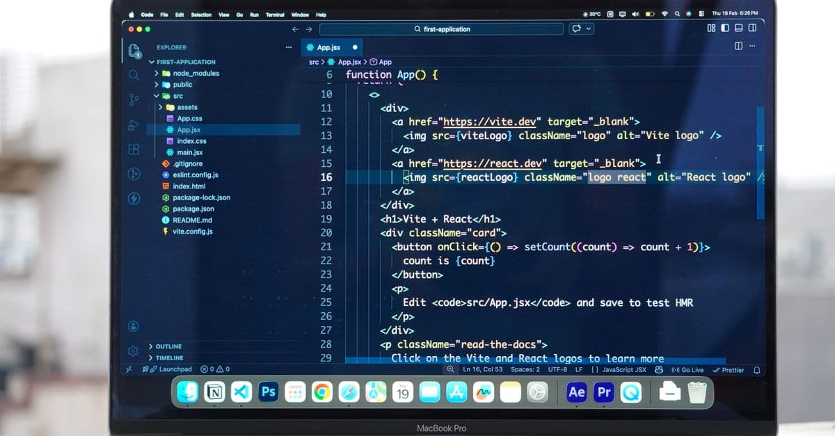 Laptop with code editor open on a rooftop, showcasing remote web development and modern work flexibility.