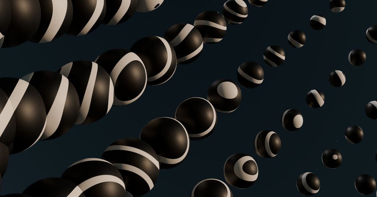 Dynamic abstract image featuring black and white spheres creating a modern aesthetic.