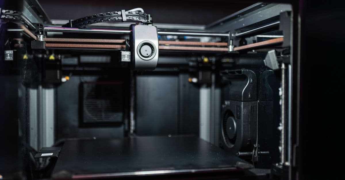 Close-up view of a modern 3D printer interior showcasing advanced technology.