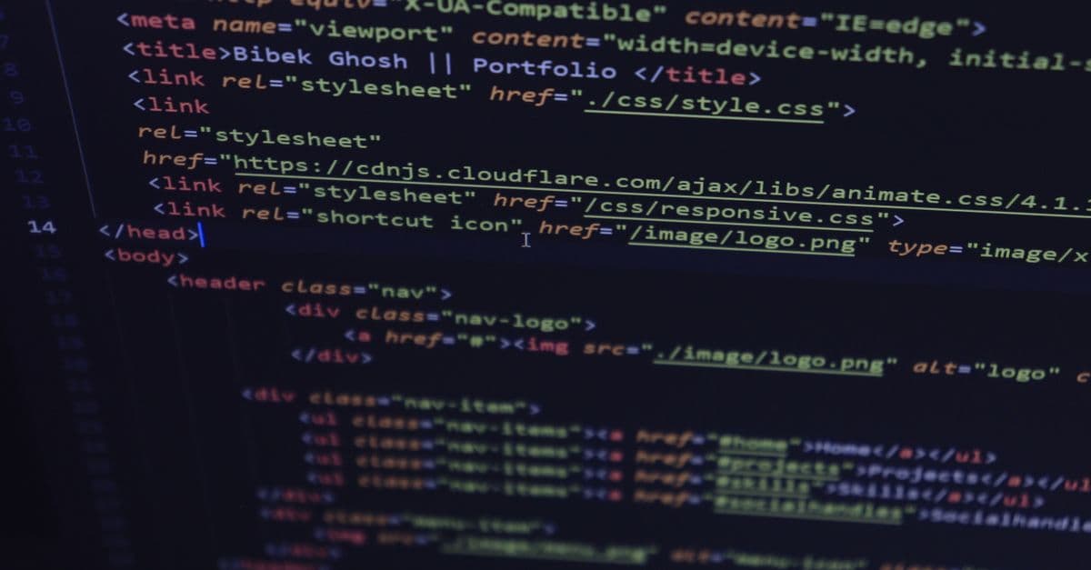 Close-up of HTML and CSS code displayed on a computer screen, ideal for tech and programming themes.
