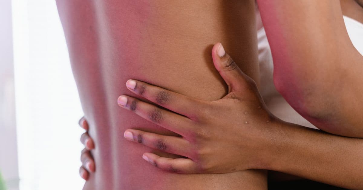 A close-up shot of an intimate and gentle embrace showcasing human connection.