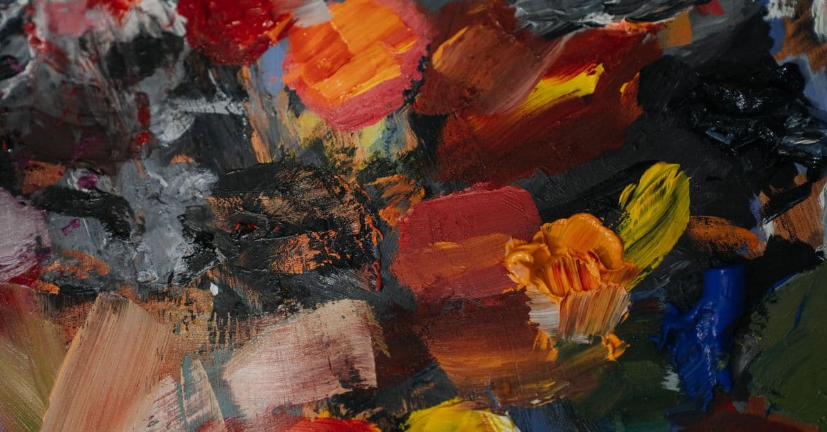 Colorful abstract oil paint texture with dynamic brush strokes and vivid hues.