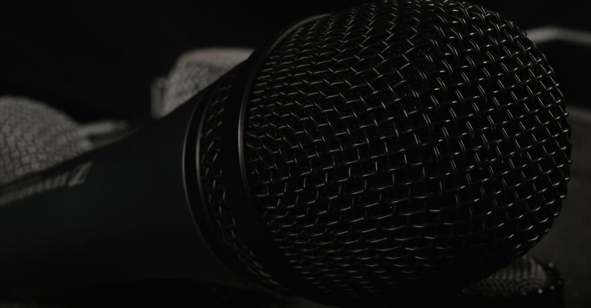 A detailed close-up of professional microphones featuring windscreens, ideal for tech and audio themes.