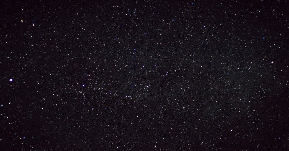 A clear starry night sky captured over the countryside in Germany, showcasing countless stars.