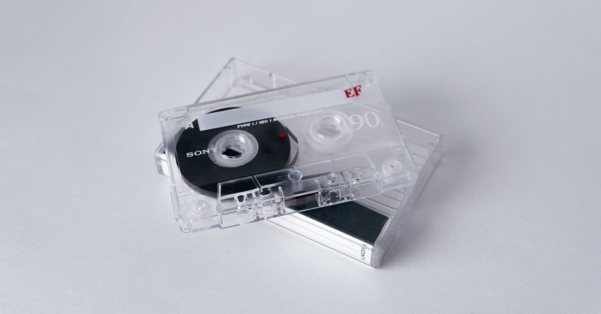 Vintage cassette tapes stacked on a white background, evoking nostalgia and classic music vibes.