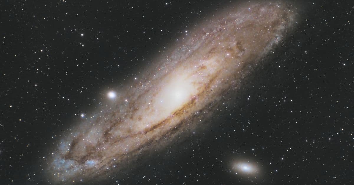 Astrophotography of the Andromeda Galaxy (Messier 31) in the star-filled night sky.