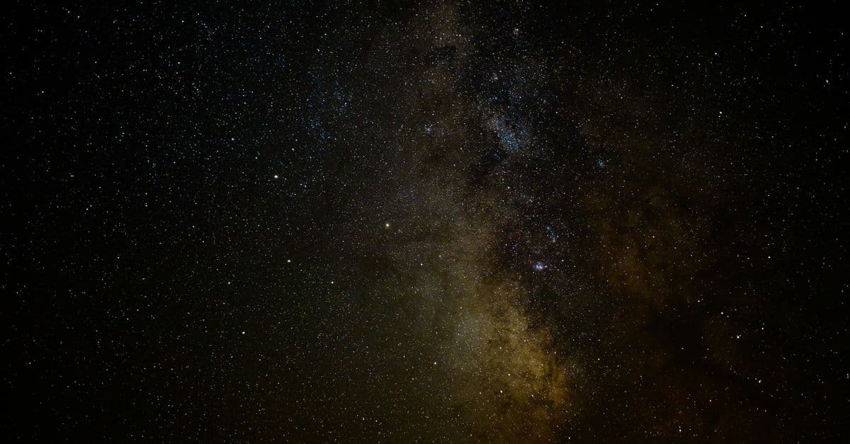 A breathtaking night sky showcasing the Milky Way galaxy, filled with countless stars and celestial formations.