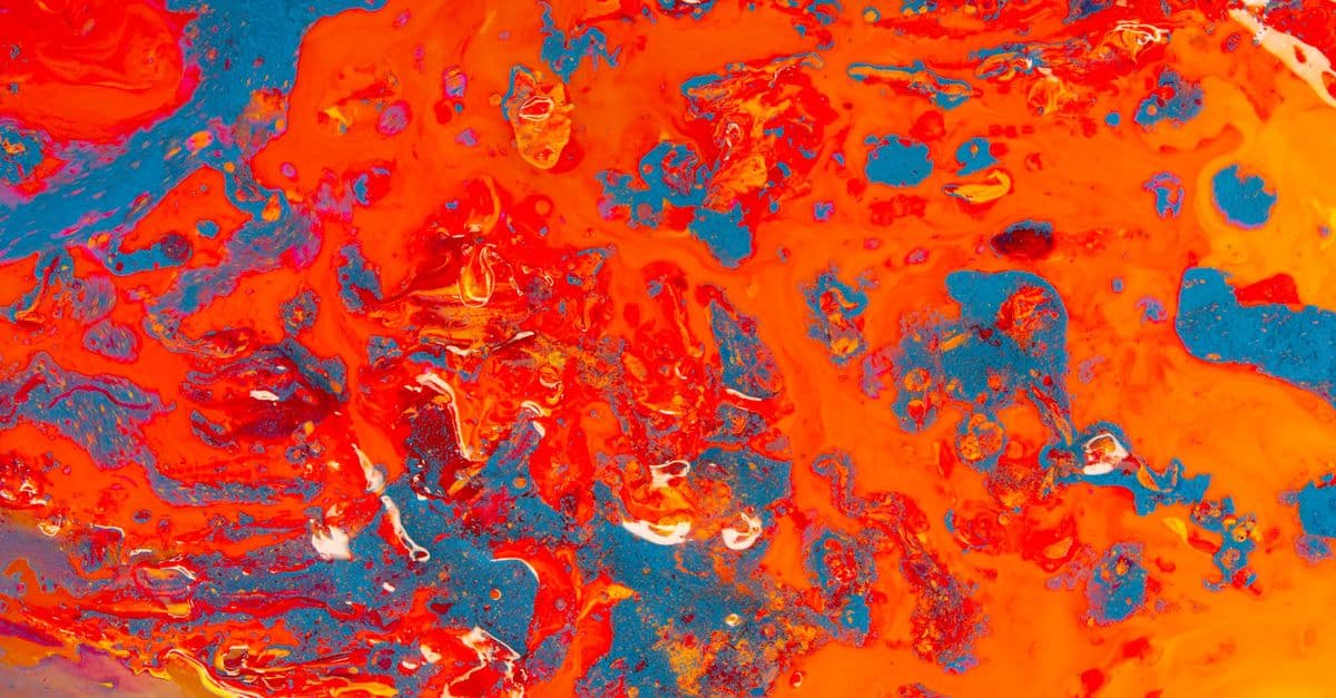 Colorful abstract artwork featuring striking blue and orange swirls and textures.