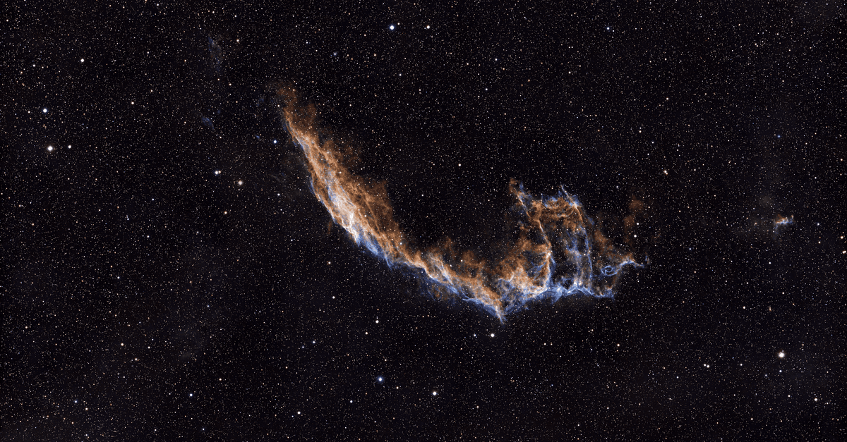 Capture of the Veil Nebula against a dense starfield, showcasing cosmic beauty.