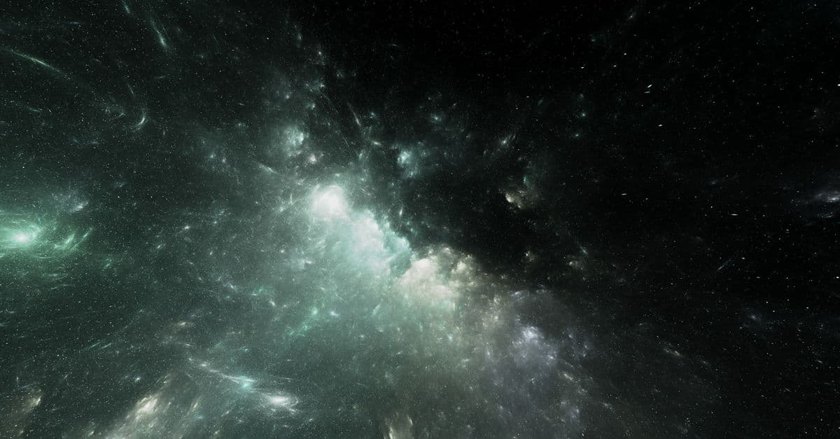 Ethereal image of a colorful nebula set against the vast starry cosmos.