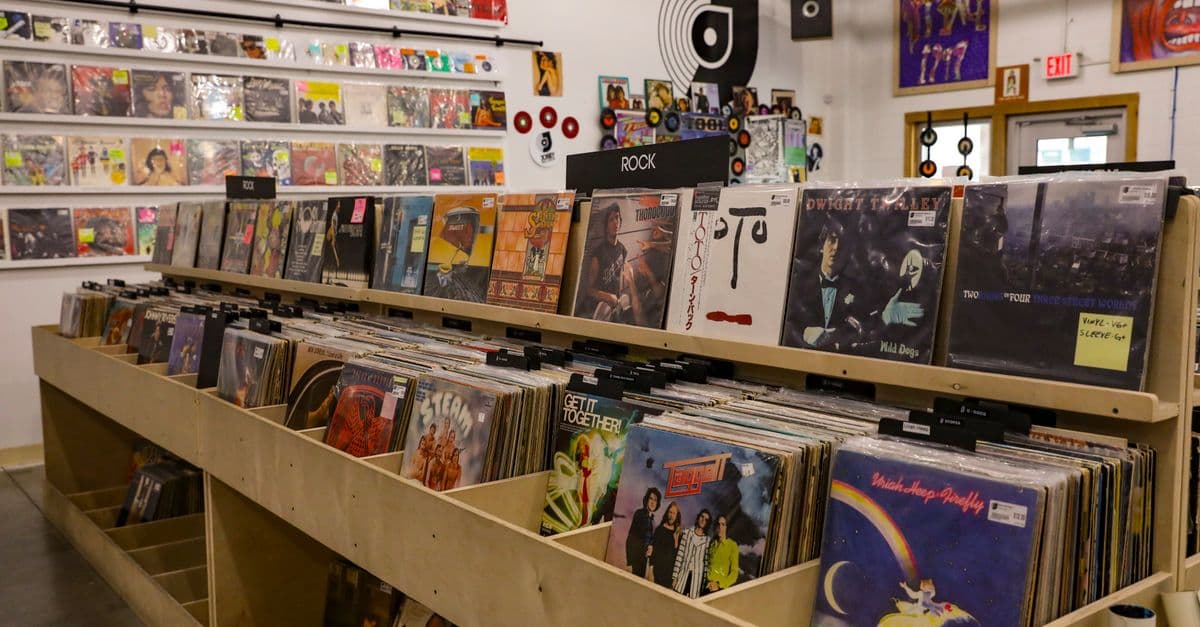 Browse vinyl records at a retro store in Tulsa, OK, featuring classic rock and eclectic album covers.