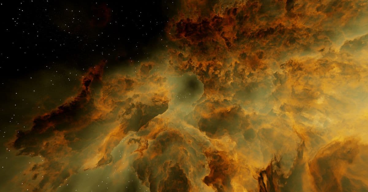 A mesmerizing view of a colorful nebula with stars in deep space.