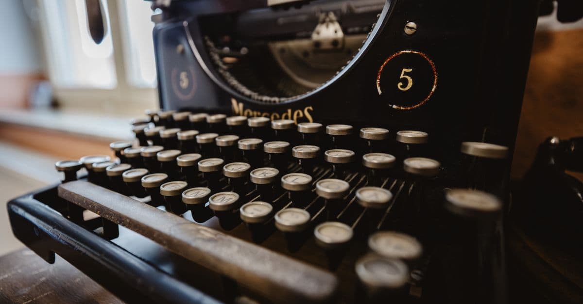 Detailed view of an antique typewriter with focus on keys, vintage aesthetic.