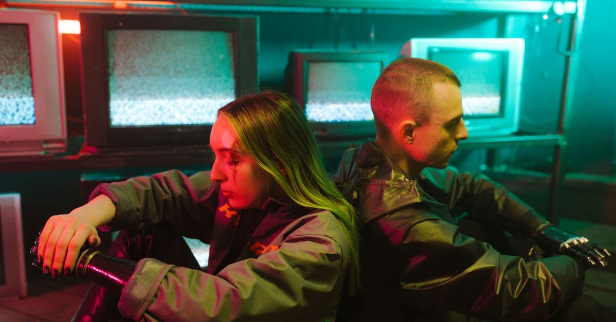 A futuristic scene capturing two individuals in a cyberpunk setting surrounded by televisions.
